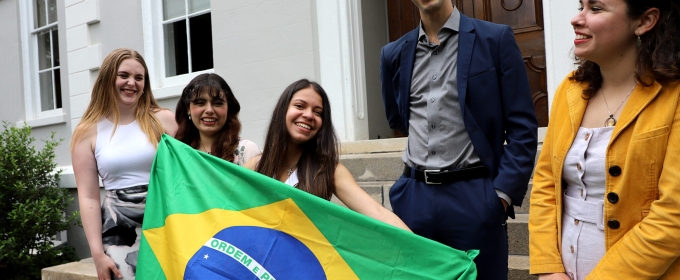 photo of five people with Brazil flag