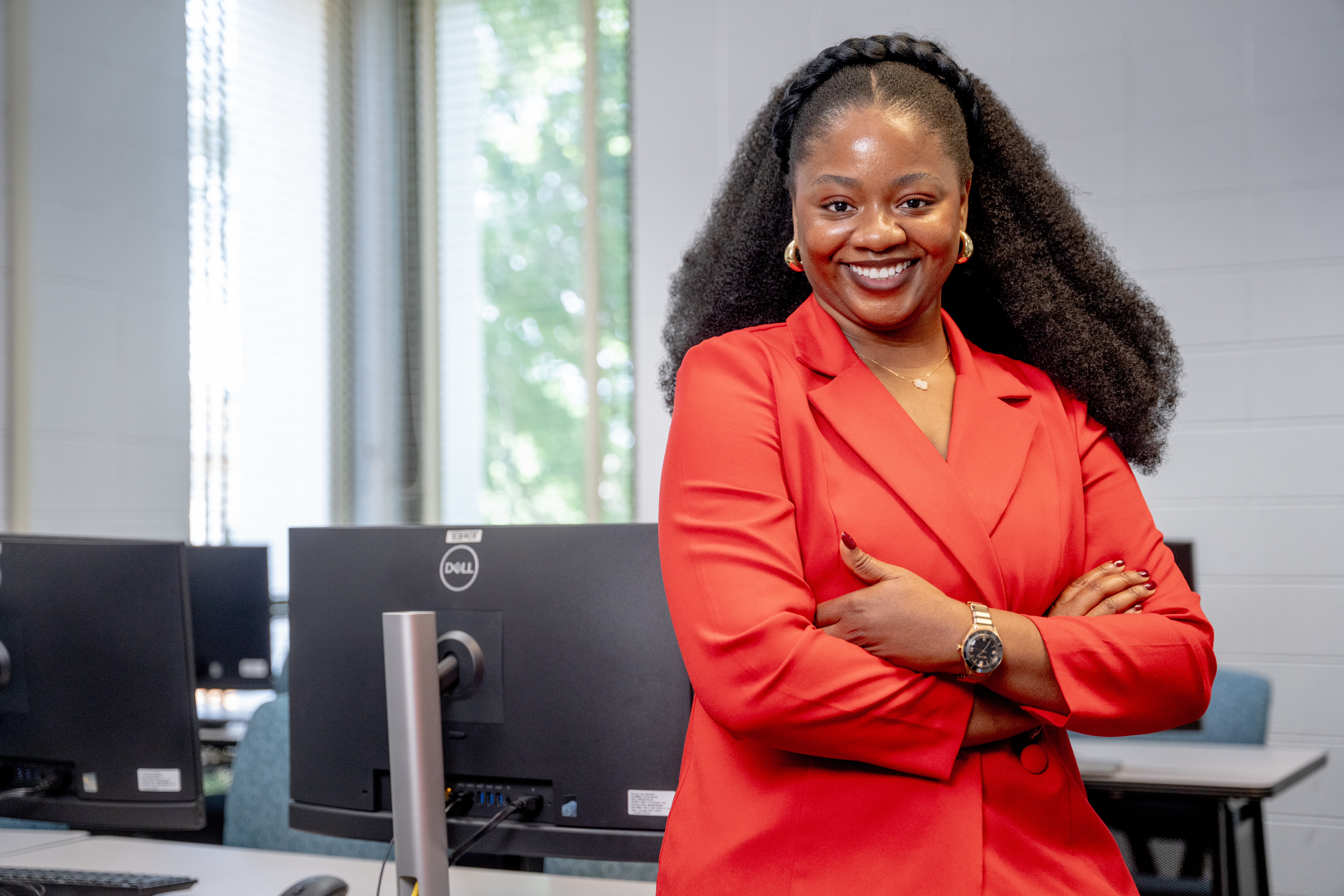 Jane Odum in front of computers 