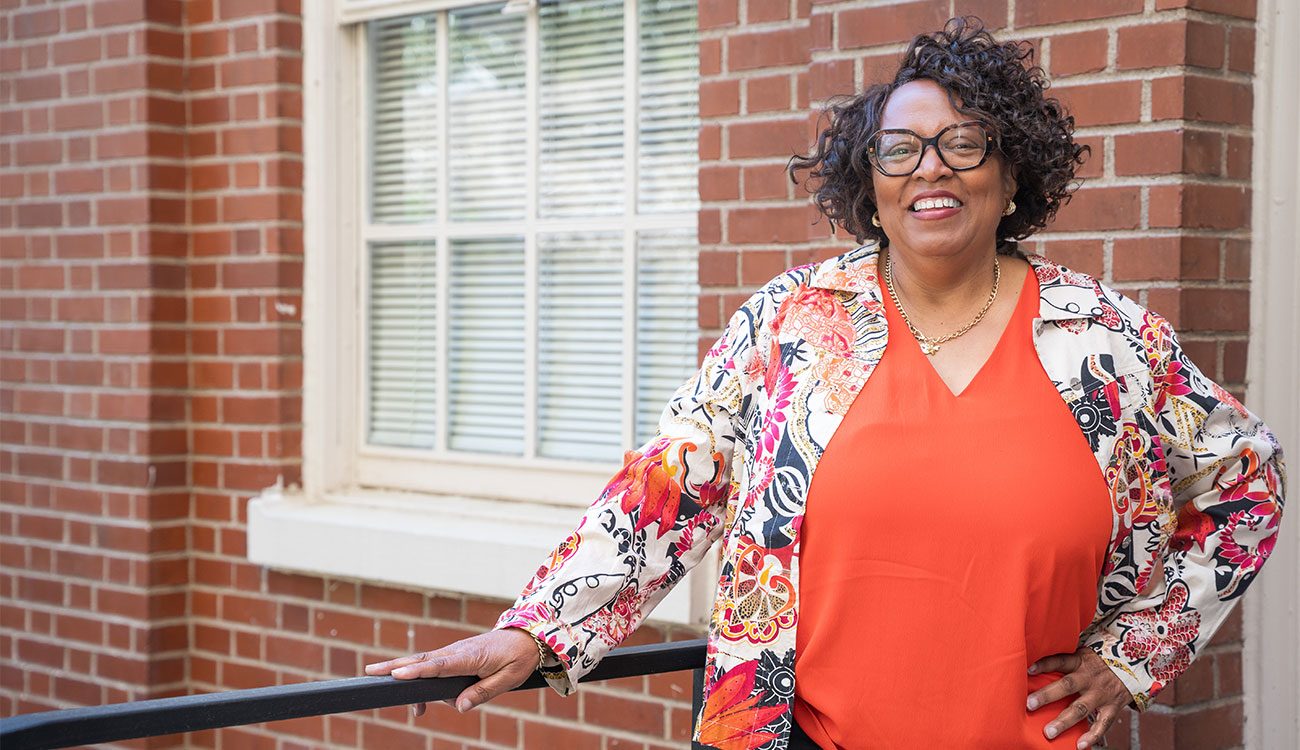 Barbara McCaskill in front of brick building