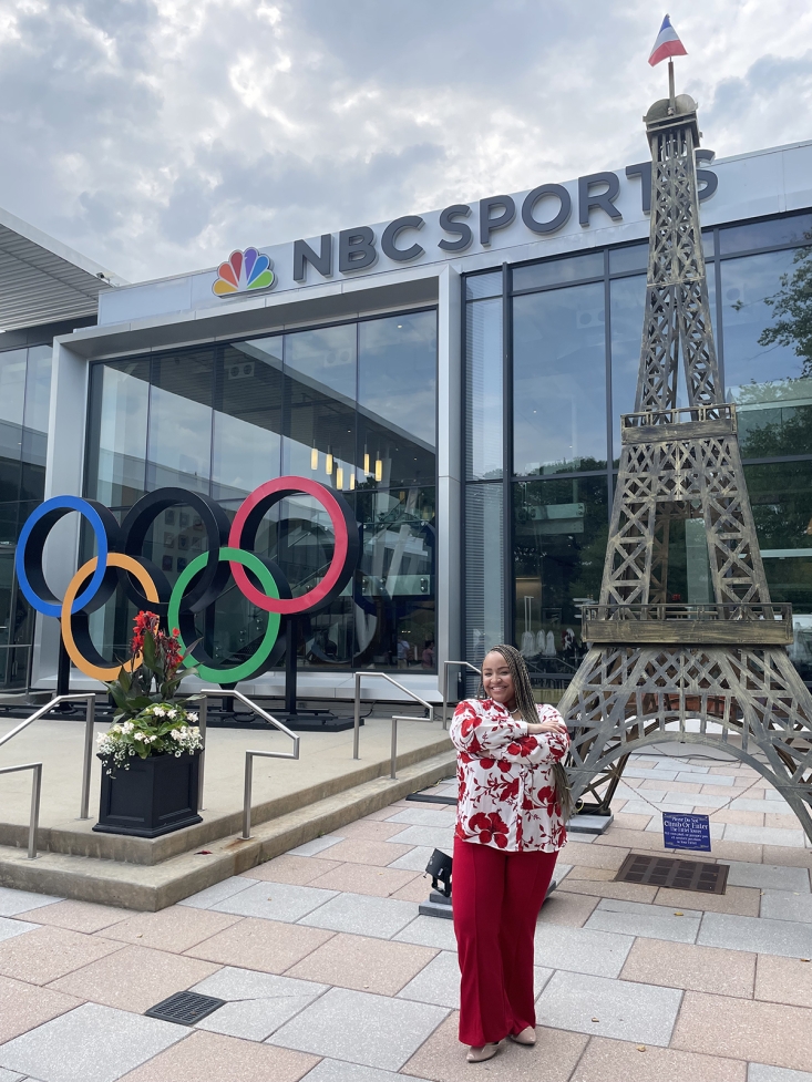 Photo of woman with Olympic Rings, Eiffel Tower replica