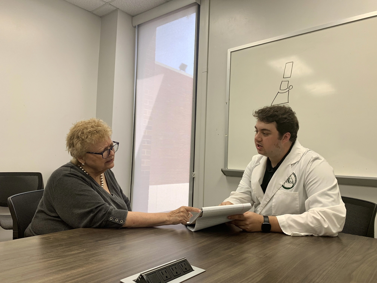 photo of two people at a table