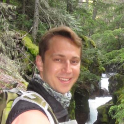 Jason Roberts hiking in the woods