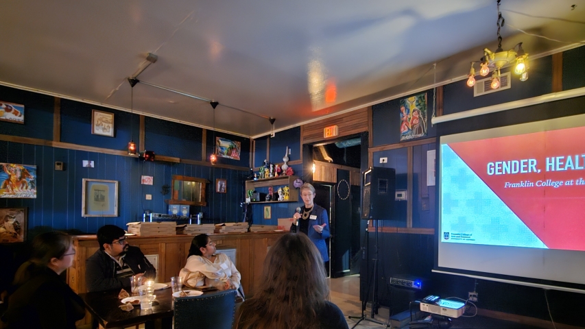 photo of speaker and audience