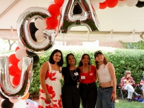 photo of four people with balloon letters