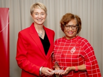 Photo of two women holding award