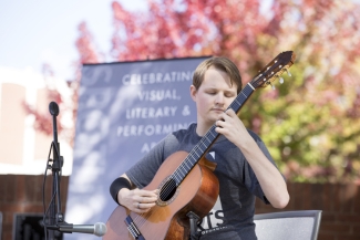 student playing guitar