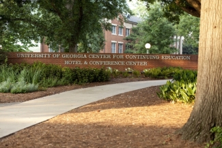 photo of sign on low brick wall