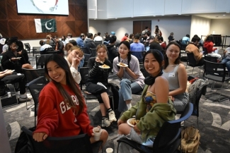 photo of group of people sitting together 