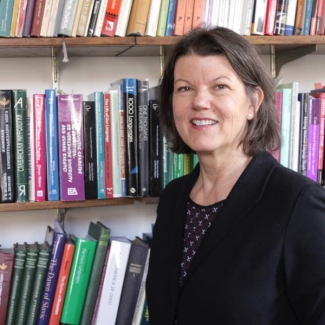 photo of woman, books in background