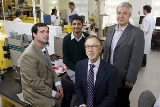 four men in a lab