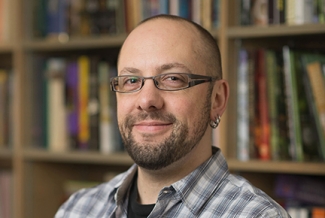 photo of man with books