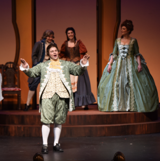 photo of singers in 19th century costumes on stage