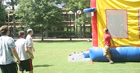 people with inflated bounce house