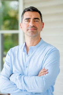 photo of man, house in background, day