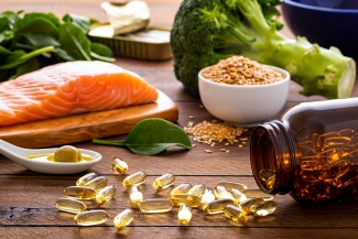 photo of vitamins, salmon steak, broccoli, spinach