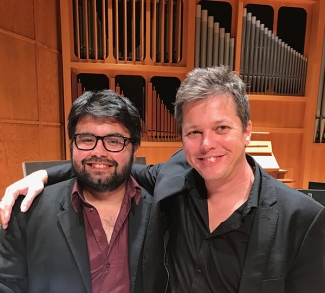 photo of two men in a concert hall