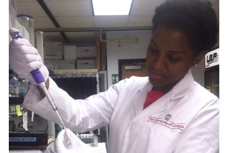 woman in lab with injector