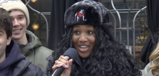 photo of woman with winter hat and microphone