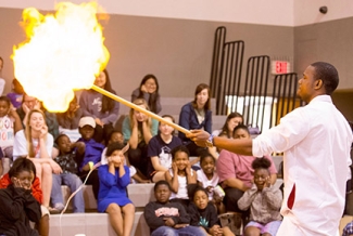 man, with students and fire demo