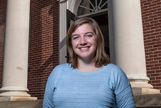 woman next to building with columns