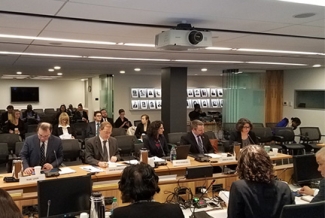 people seated in a briefing room