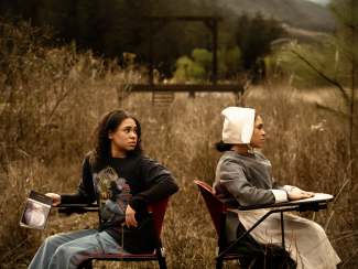 photo oto two people, in field, with desks, day