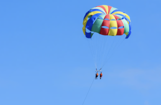 photo of two people parasailing