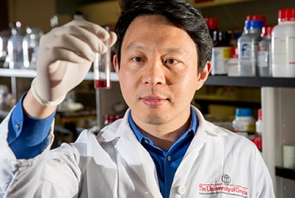 man in lab with test tube