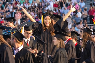 group of grads with women at center