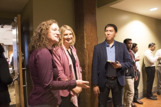 photo of several people speaking at an event