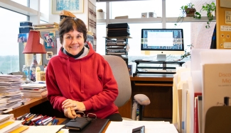 photo of woman in office, with windows, day