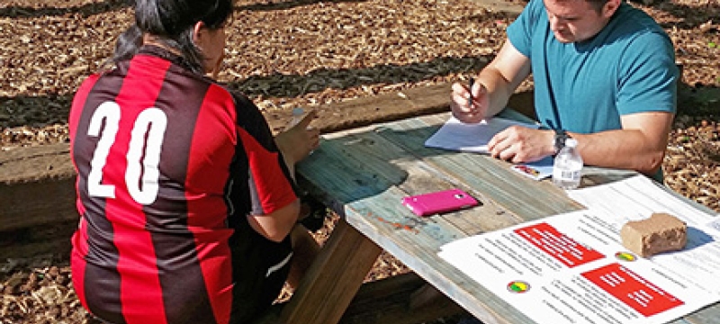 man and woman at table outdoors