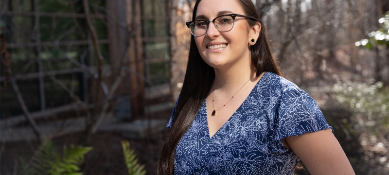 photo of woman outdoors, trees in background, day