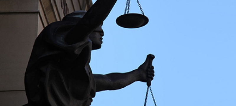 photo of statue representing blind justice