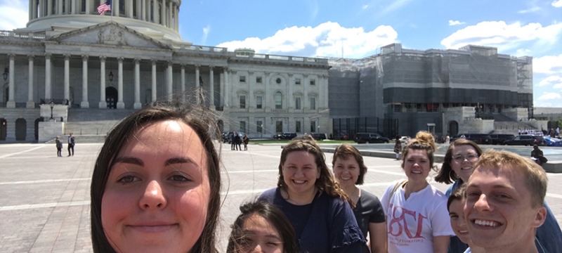 photo of eight students with US capitol building