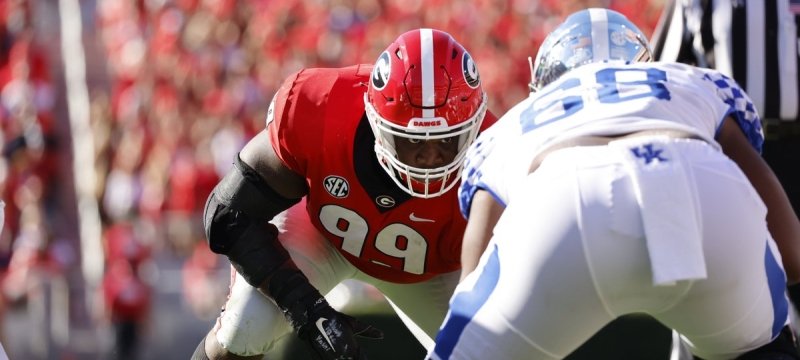 photo of football players in game