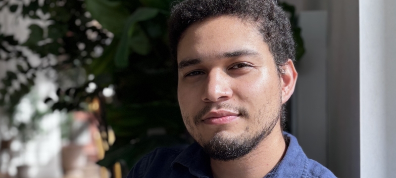 photo of man, plant in background