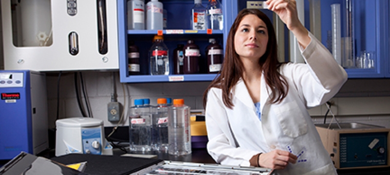 woman in lab with slides