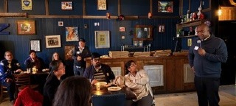 photo of speaker and audience