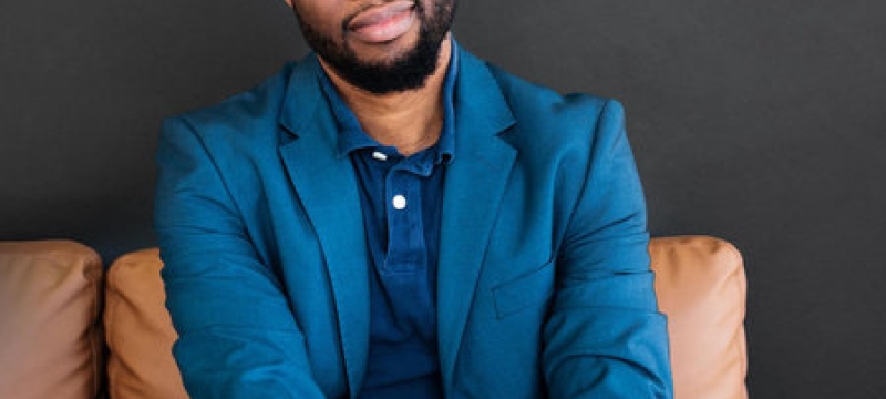 photo of man seated in chair