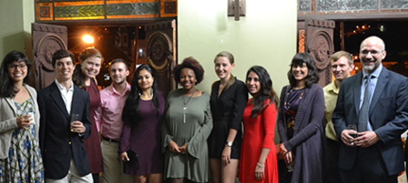 group photo in front of old large doors