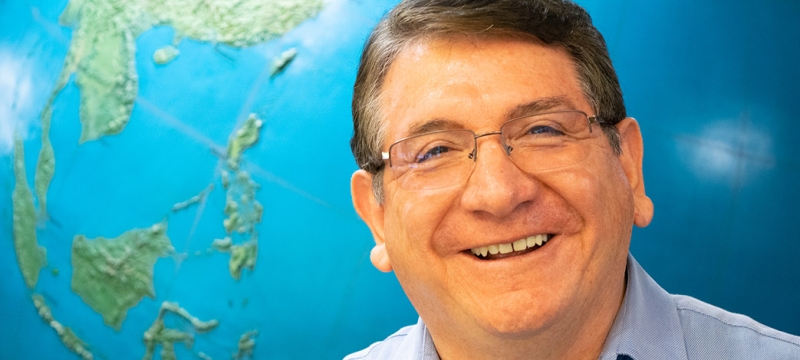 photo of man with globe background