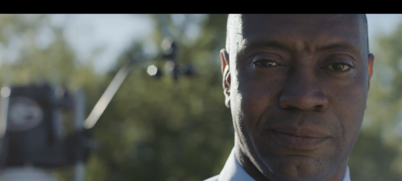 still of man on screen