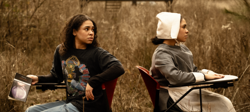 photo oto two people, in field, with desks, day