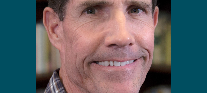headshot photo of man, with graphic frame