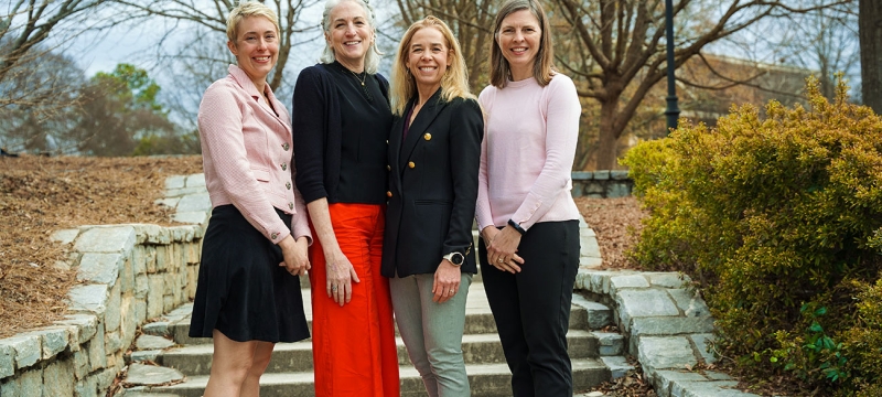 photo of four women on walkway, day