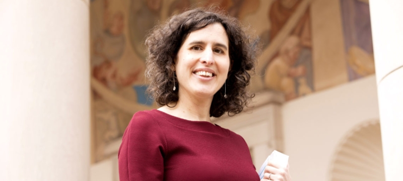 photo of women standing outside of fine arts buildings