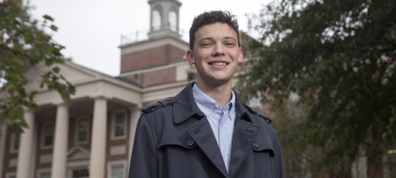 Photo of man in front of building (park hall)