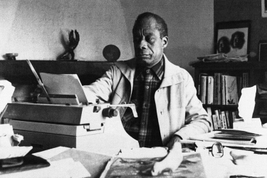 b/w photo of man with typewriter