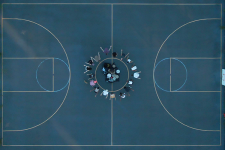 photo of basketball court with people at the center, from above